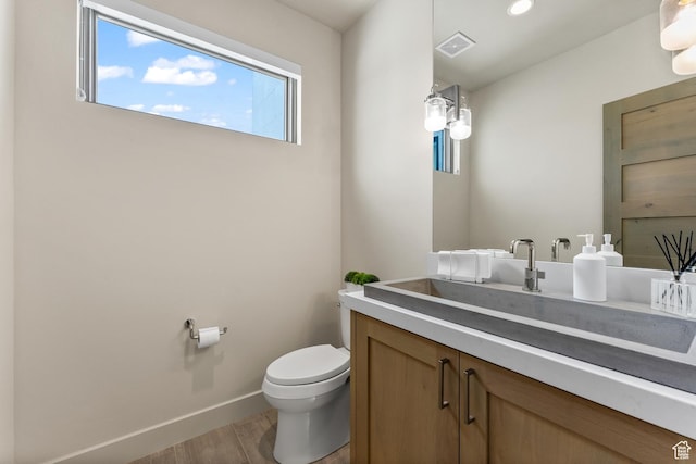6312 Double Deer Loop, Park City, UT 84098 - half bathroom featuring wood finished floors, toilet, vanity, baseboards, and recessed lighting