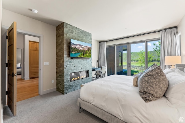 6312 Double Deer Loop, Park City, UT 84098 - bedroom featuring access to exterior, a fireplace, and carpet floors