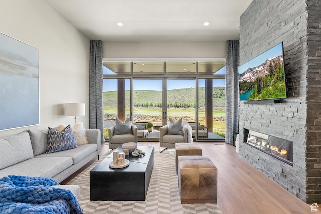 6312 Double Deer Loop, Park City, UT 84098 - living room with wood finished floors, a stone fireplace, and recessed lighting