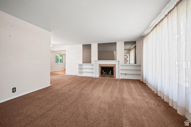 95 E 1400 S, Bountiful, UT 84010 - unfurnished living room with light carpet, a fireplace with flush hearth, and baseboards