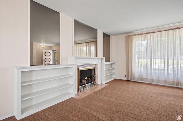 95 E 1400 S, Bountiful, UT 84010 - living area with carpet, healthy amount of natural light, a fireplace with flush hearth, and baseboards