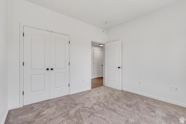 3478 S Cozy River Pl W Unit 210, West Valley City, UT 84119 - unfurnished bedroom with carpet, a closet, and baseboards
