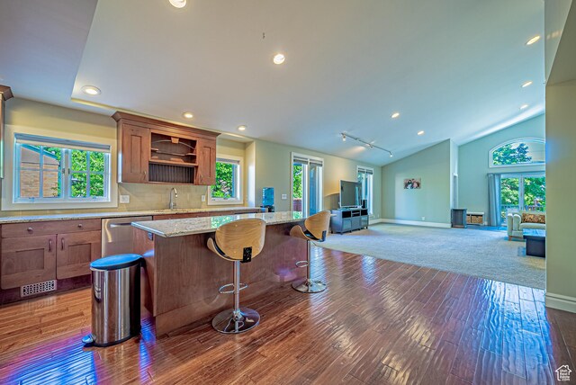 1820 E Redondo Ave S, Salt Lake City, UT 84108 - kitchen with dishwasher, a sink, open floor plan, hardwood / wood-style flooring, and a kitchen island