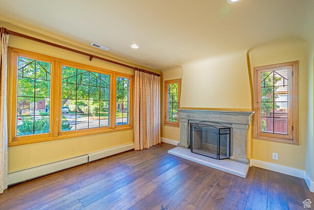 1820 E Redondo Ave S, Salt Lake City, UT 84108 - unfurnished living room featuring a baseboard radiator, baseboards, a premium fireplace, wood-type flooring, and recessed lighting