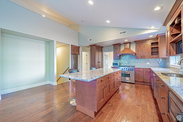 1820 E Redondo Ave S, Salt Lake City, UT 84108 - kitchen featuring custom exhaust hood, stainless steel appliances, a sink, open shelves, and lofted ceiling