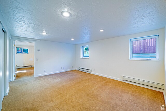 1820 E Redondo Ave S, Salt Lake City, UT 84108 - carpeted empty room with a baseboard radiator, baseboard heating, a baseboard heating unit, a textured ceiling, and baseboards