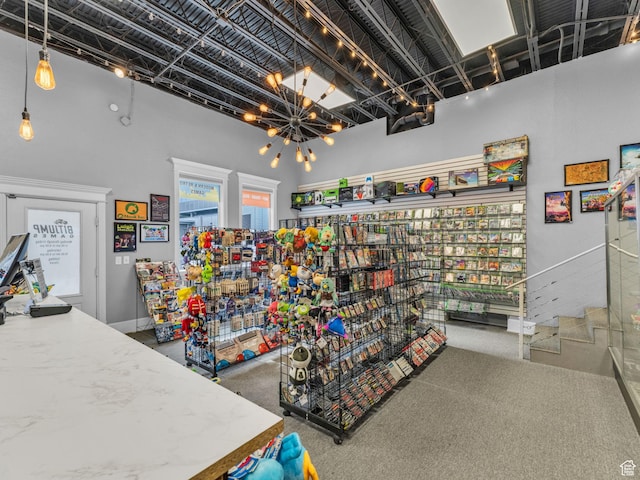 40 S Freedom Blvd, Provo, UT 84601 - misc room with a towering ceiling, carpet, and a chandelier