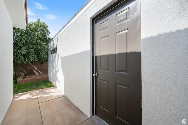 2137 E 170th Cir S, St George, UT 84790 - doorway to property featuring stucco siding and a patio area