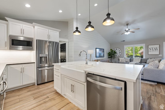 2137 E 170th Cir S, St George, UT 84790 - kitchen with appliances with stainless steel finishes, lofted ceiling, open floor plan, light wood-style floors, and a ceiling fan