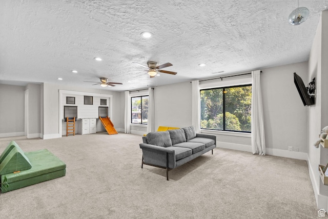 845 N 950 W, Provo, UT 84604 - sitting room with carpet floors, baseboards, a textured ceiling, recessed lighting, and a ceiling fan