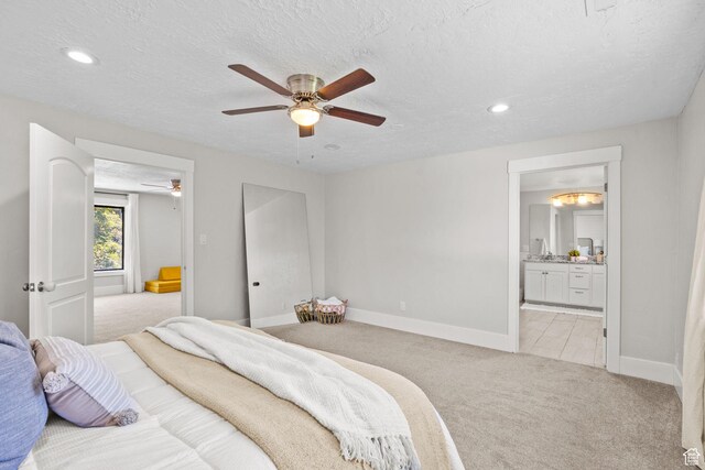 845 N 950 W, Provo, UT 84604 - bedroom with light colored carpet, baseboards, recessed lighting, a textured ceiling, and ensuite bathroom