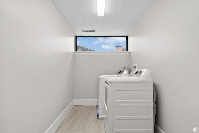 845 N 950 W, Provo, UT 84604 - laundry area featuring independent washer and dryer, a textured ceiling, and baseboards