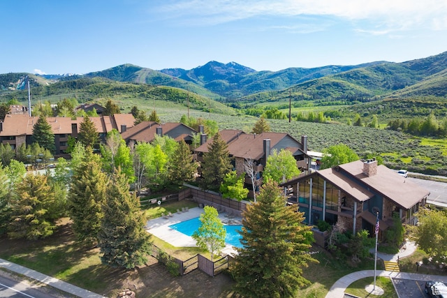 7085 N 2200 W Unit 1I, Park City, UT 84098 - aerial view of residential area with a pool area and a mountain backdrop
