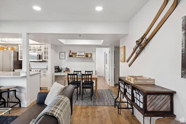 7085 N 2200 W Unit 1I, Park City, UT 84098 - dining space with light wood-style floors, recessed lighting, and a skylight