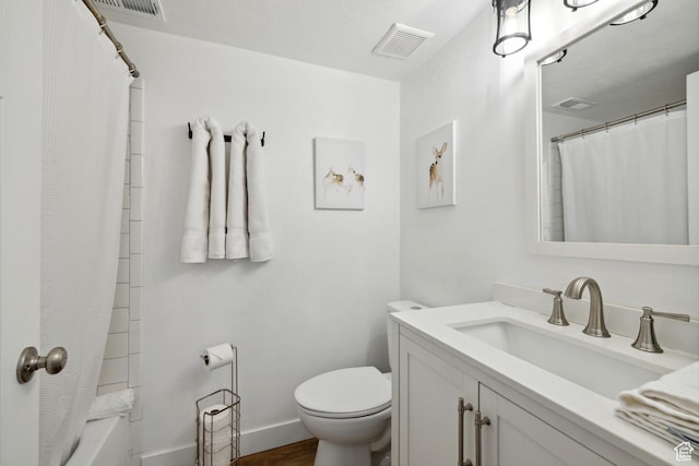 7085 N 2200 W Unit 1I, Park City, UT 84098 - bathroom with vanity, toilet, wood finished floors, shower / bath combination with curtain, and baseboards