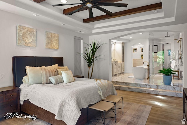 916 E Apache Dr, Washington, UT 84780 - bedroom with a tray ceiling, arched walkways, wood finished floors, recessed lighting, and ensuite bath
