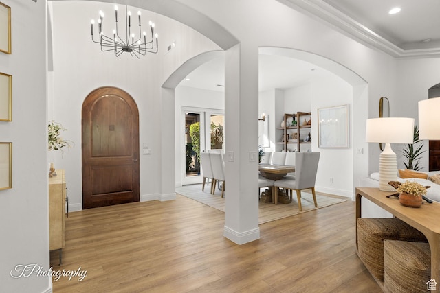 916 E Apache Dr, Washington, UT 84780 - entrance foyer featuring a chandelier, light wood-style flooring, recessed lighting, arched walkways, and baseboards