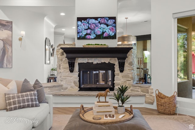 916 E Apache Dr, Washington, UT 84780 - living area with wood finished floors, a stone fireplace, and recessed lighting