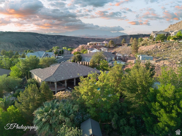 916 E Apache Dr, Washington, UT 84780 - aerial overview of property's location with a mountainous background and nearby suburban area