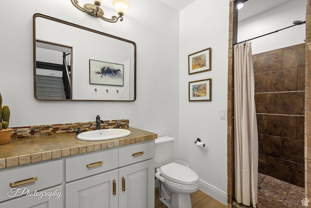 916 E Apache Dr, Washington, UT 84780 - full bathroom featuring vanity, toilet, and a tile shower