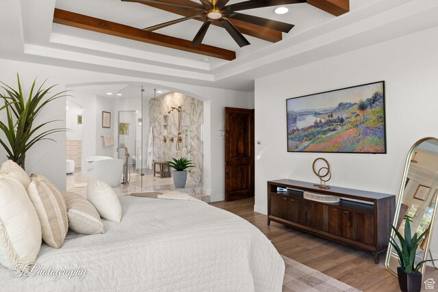 916 E Apache Dr, Washington, UT 84780 - bedroom with a tray ceiling, ensuite bathroom, arched walkways, wood finished floors, and recessed lighting