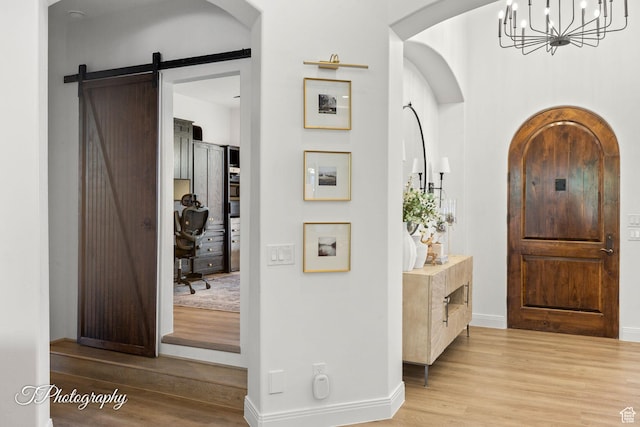 916 E Apache Dr, Washington, UT 84780 - entryway with wood finished floors, a chandelier, baseboards, and arched walkways