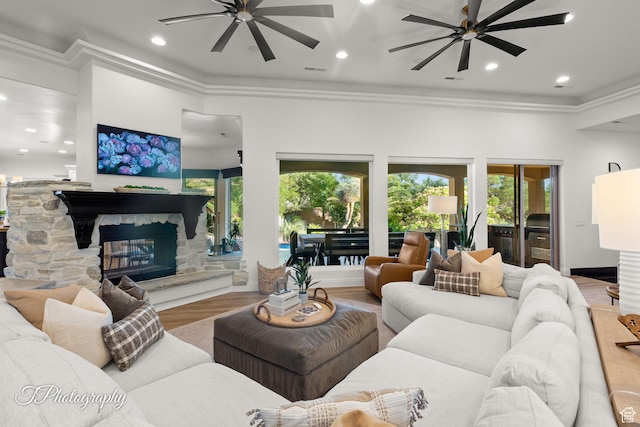 916 E Apache Dr, Washington, UT 84780 - living area featuring ceiling fan, ornamental molding, wood finished floors, a fireplace, and recessed lighting