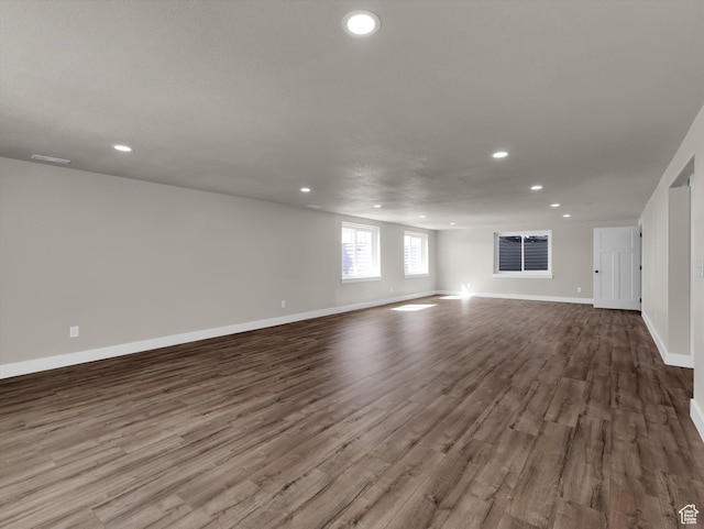 3425 W Isabel Way, West Haven, UT 84401 - unfurnished living room with dark wood-style floors, recessed lighting, and baseboards