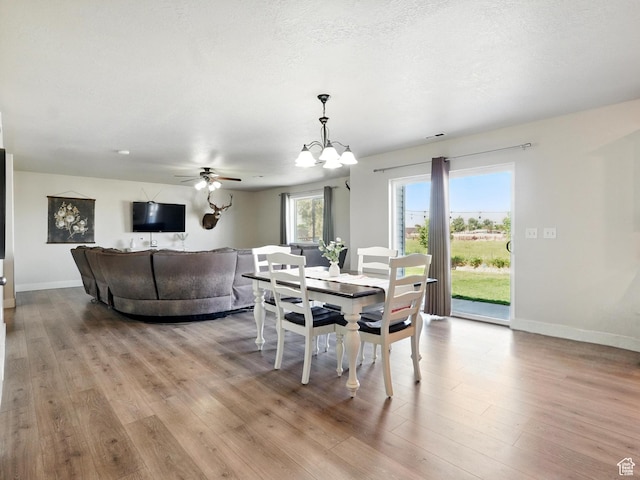 2699 N 3475 W, Plain City, UT 84404 - dining space featuring wood finished floors, baseboards, a chandelier, and ceiling fan
