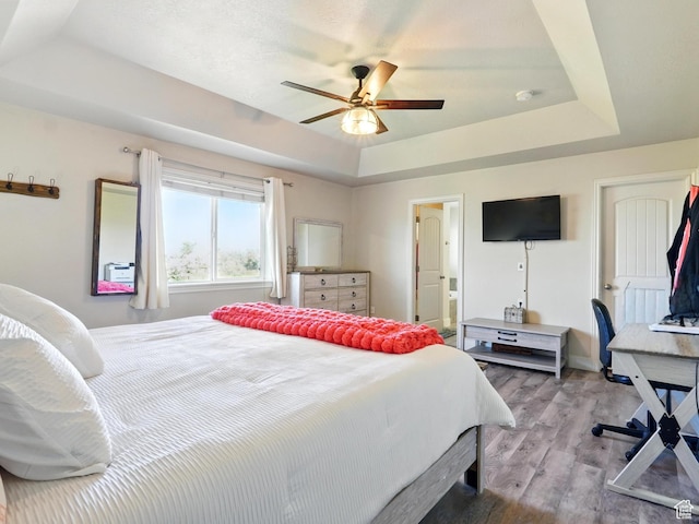 2699 N 3475 W, Plain City, UT 84404 - bedroom with a raised ceiling, wood finished floors, ensuite bath, and a ceiling fan