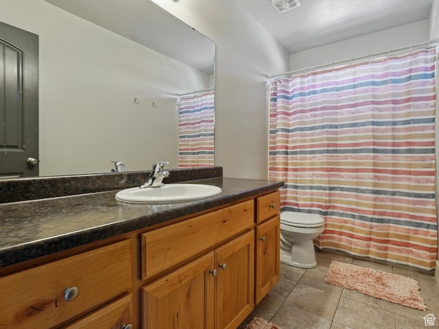 2699 N 3475 W, Plain City, UT 84404 - full bath featuring vanity, toilet, tile patterned floors, and a shower with shower curtain