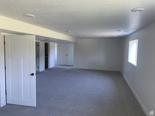 4618 W 75 N Unit 404, West Point, UT 84015 - carpeted empty room featuring a textured ceiling and baseboards