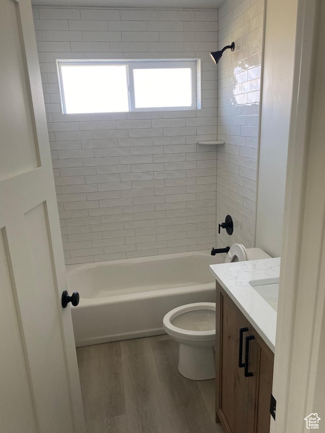 4618 W 75 N Unit 404, West Point, UT 84015 - full bathroom with toilet, wood finished floors, vanity, and washtub / shower combination