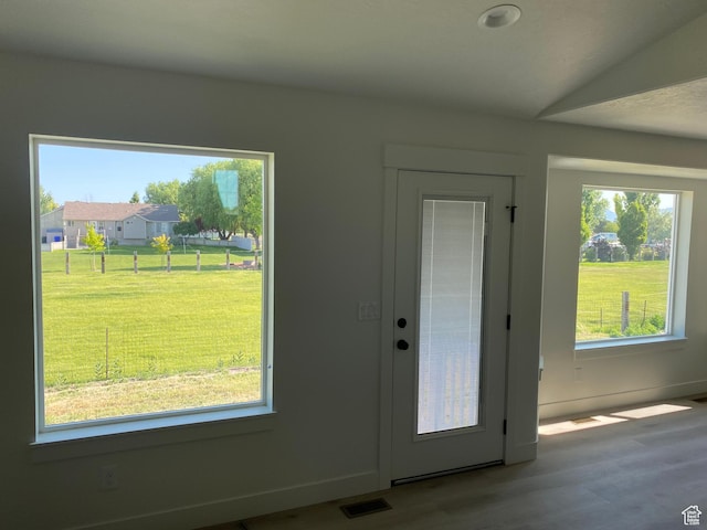 4618 W 75 N Unit 404, West Point, UT 84015 - doorway to outside featuring plenty of natural light, wood finished floors, and baseboards