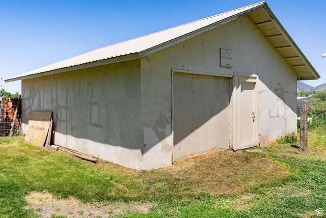 1435 W 600 S, Logan, UT 84321 - view of side of property featuring metal roof, a yard, and an outdoor structure