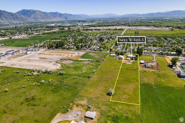 1435 W 600 S, Logan, UT 84321 - aerial view of property and surrounding area featuring a mountain backdrop and property boundaries highlighted