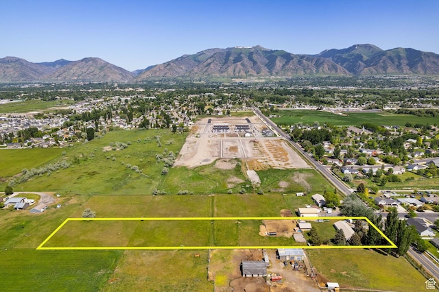 1435 W 600 S, Logan, UT 84321 - aerial view of residential area with a mountainous background and property parcel outlined