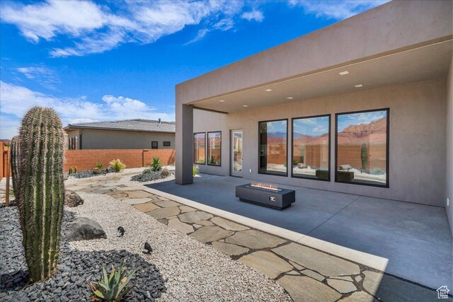 133 E Terrace Ln, Ivins, UT 84738 - view of patio with an outdoor fire pit