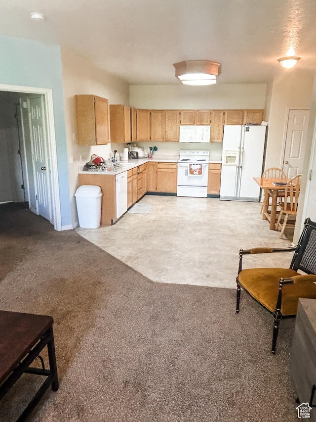 532 N Seven Peaks Blvd Unit 303, Provo, UT 84606 - kitchen featuring white appliances, light countertops, light brown cabinetry, a sink, and light carpet