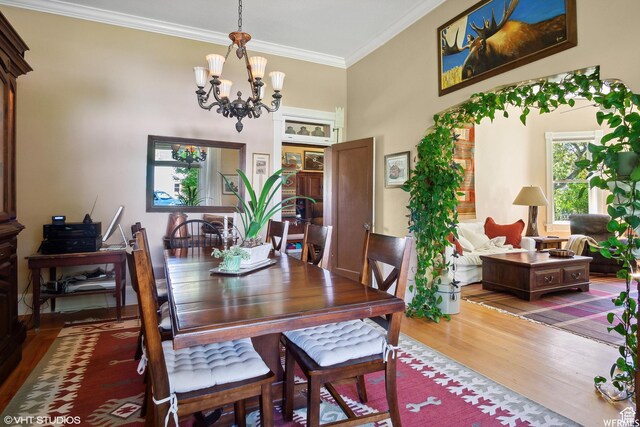 211 E 100 N, Midway, UT 84049 - dining area featuring wood finished floors, a chandelier, and ornamental molding