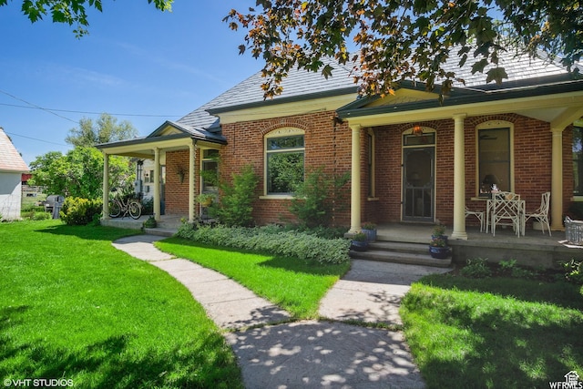 211 E 100 N, Midway, UT 84049 - view of front of property with covered porch, brick siding, a front yard, and a high end roof