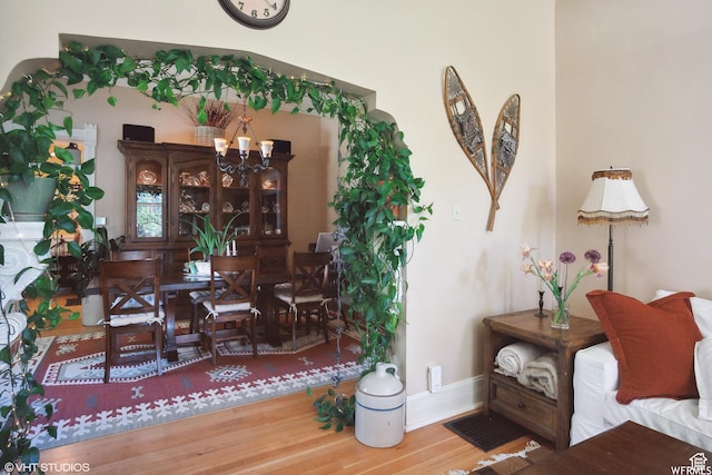 211 E 100 N, Midway, UT 84049 - dining room featuring a chandelier, baseboards, and wood finished floors