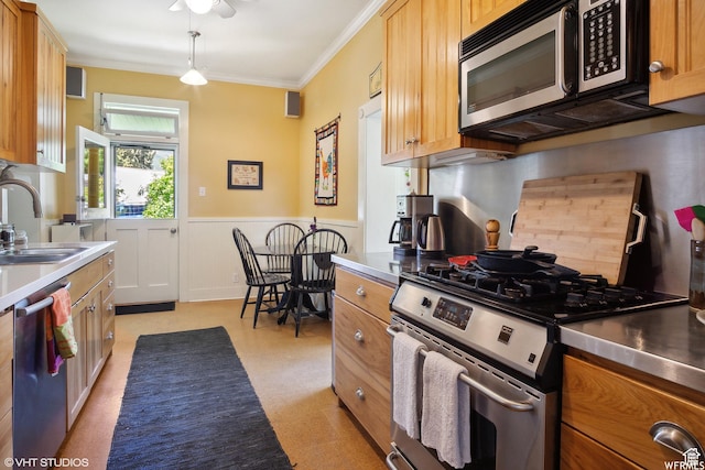 211 E 100 N, Midway, UT 84049 - kitchen with appliances with stainless steel finishes, stainless steel countertops, a sink, a wainscoted wall, and crown molding