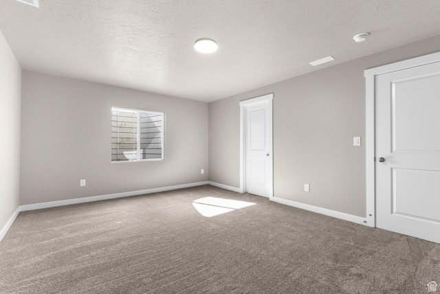 6564 N Bald Unit D195, Eagle Mountain, UT 84005 - unfurnished bedroom with carpet, baseboards, and a textured ceiling