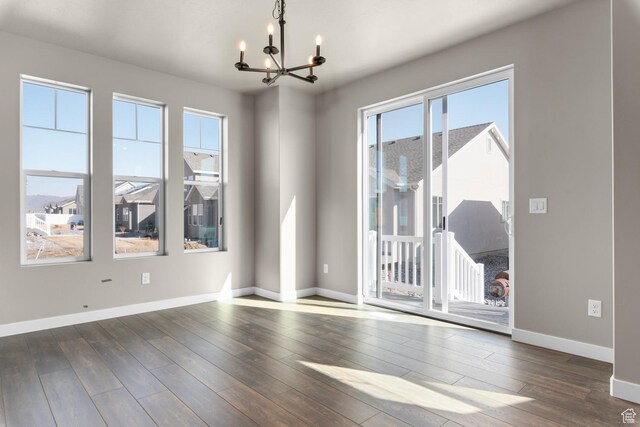 6564 N Bald Unit D195, Eagle Mountain, UT 84005 - unfurnished room with a chandelier, hardwood / wood-style flooring, and baseboards