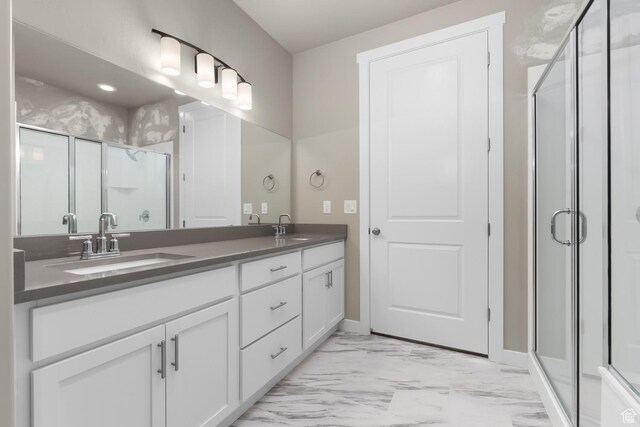 6564 N Bald Unit D195, Eagle Mountain, UT 84005 - full bathroom featuring marble look tile flooring, double vanity, a shower stall, and baseboards