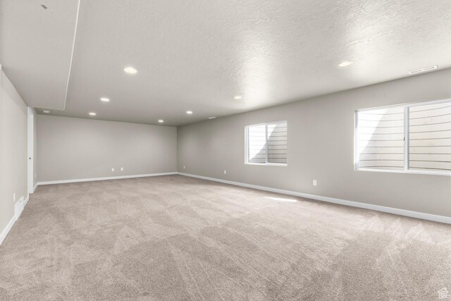 6564 N Bald Unit D195, Eagle Mountain, UT 84005 - carpeted empty room with recessed lighting, a textured ceiling, and baseboards