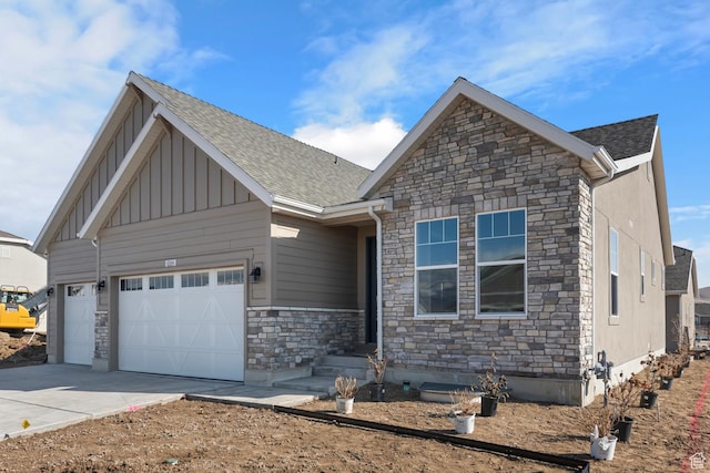 6564 N Bald Unit D195, Eagle Mountain, UT 84005 - craftsman-style home with stone siding, board and batten siding, an attached garage, concrete driveway, and roof with shingles