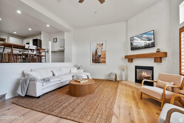 5521 N Freestyle Way, Park City, UT 84098 - living room with wood finished floors, a fireplace, ceiling fan, recessed lighting, and baseboards