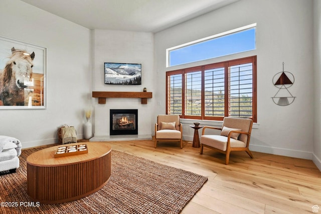 5521 N Freestyle Way, Park City, UT 84098 - living area with a fireplace, hardwood / wood-style flooring, plenty of natural light, and baseboards